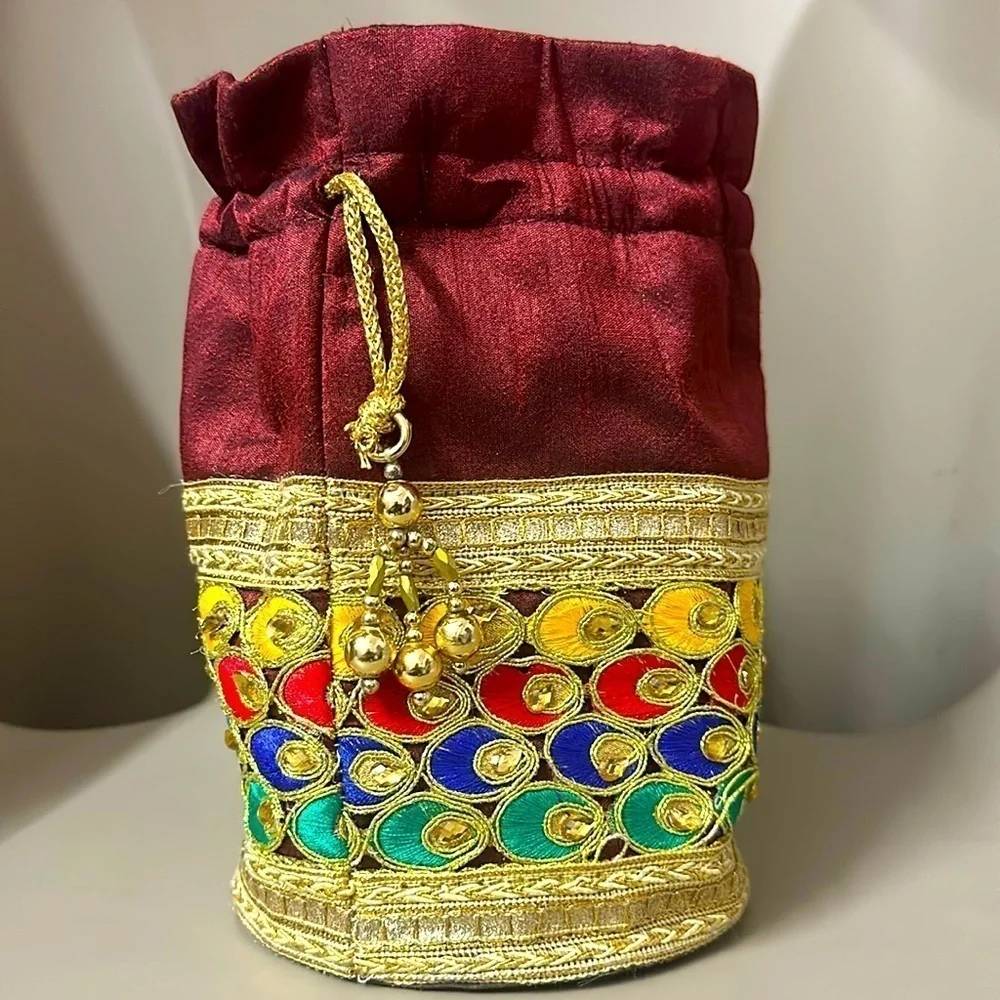 Beaded peacock colored jewelry bag